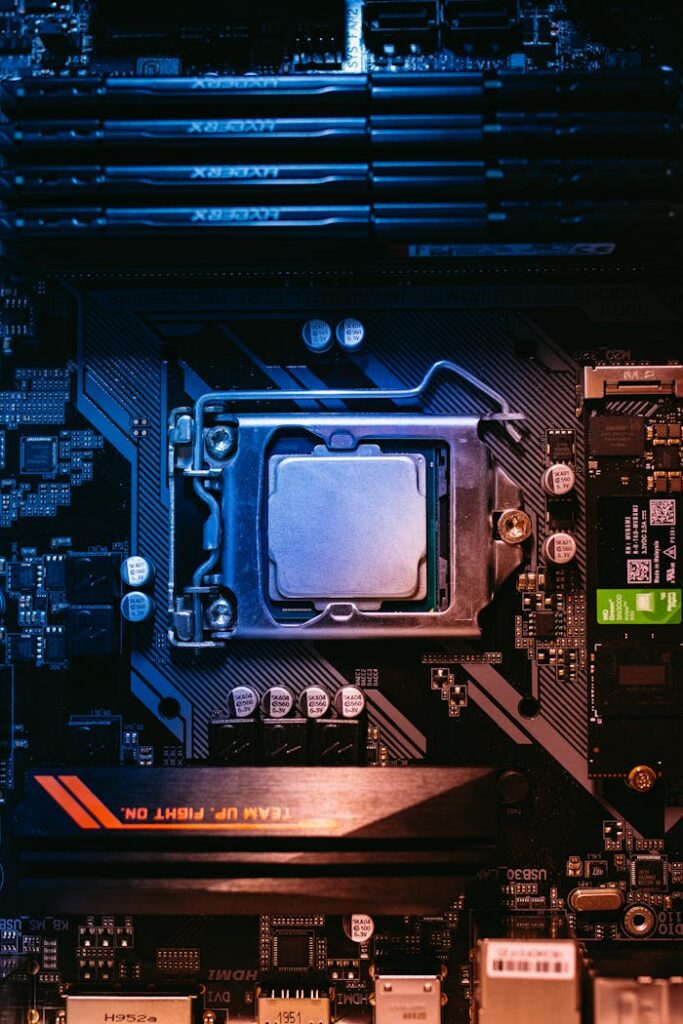 Detailed view of a computer motherboard featuring a central processor and RAM slots, highlighting its intricate design.